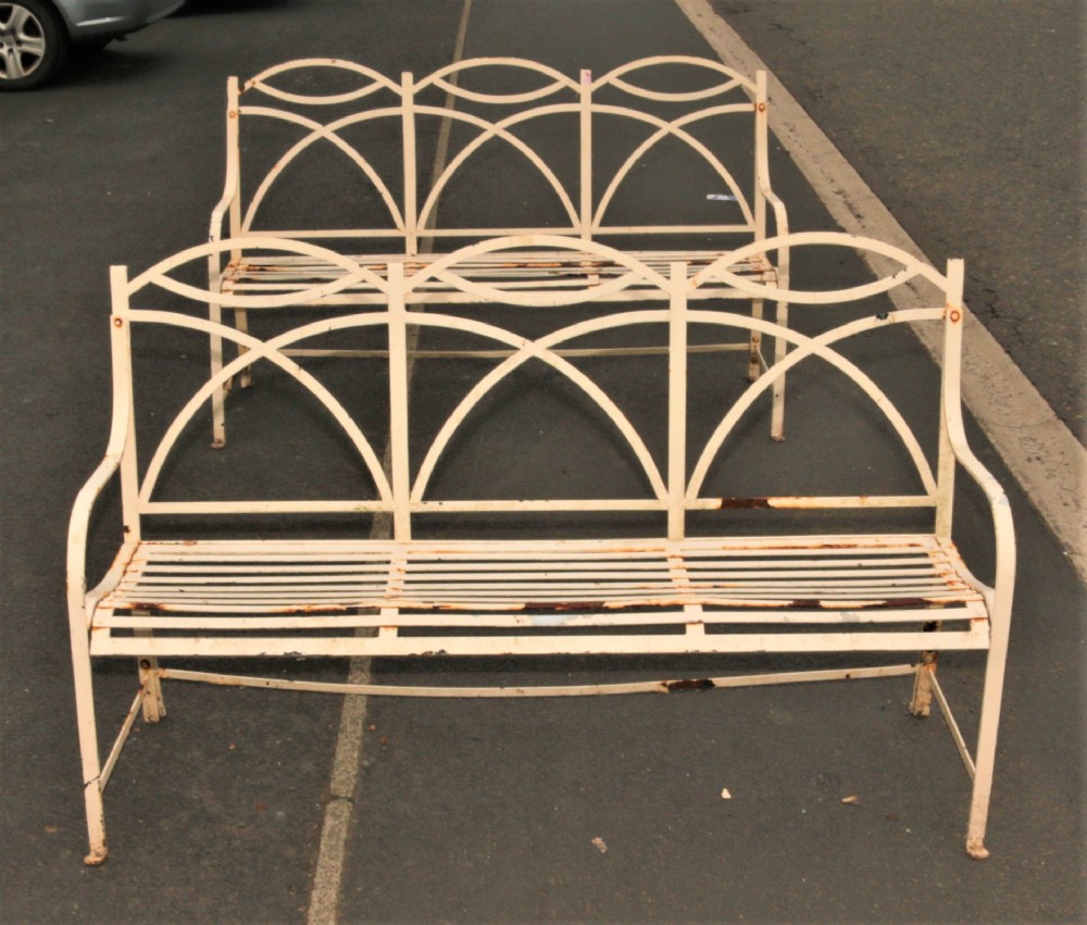 A pair of vintage iron garden benches