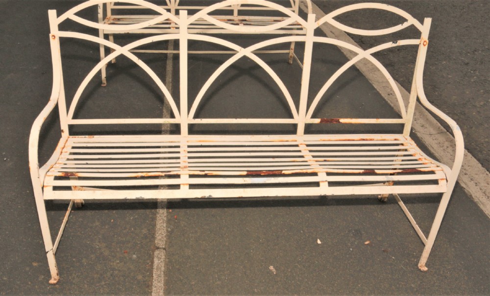 A pair of vintage iron garden benches View II