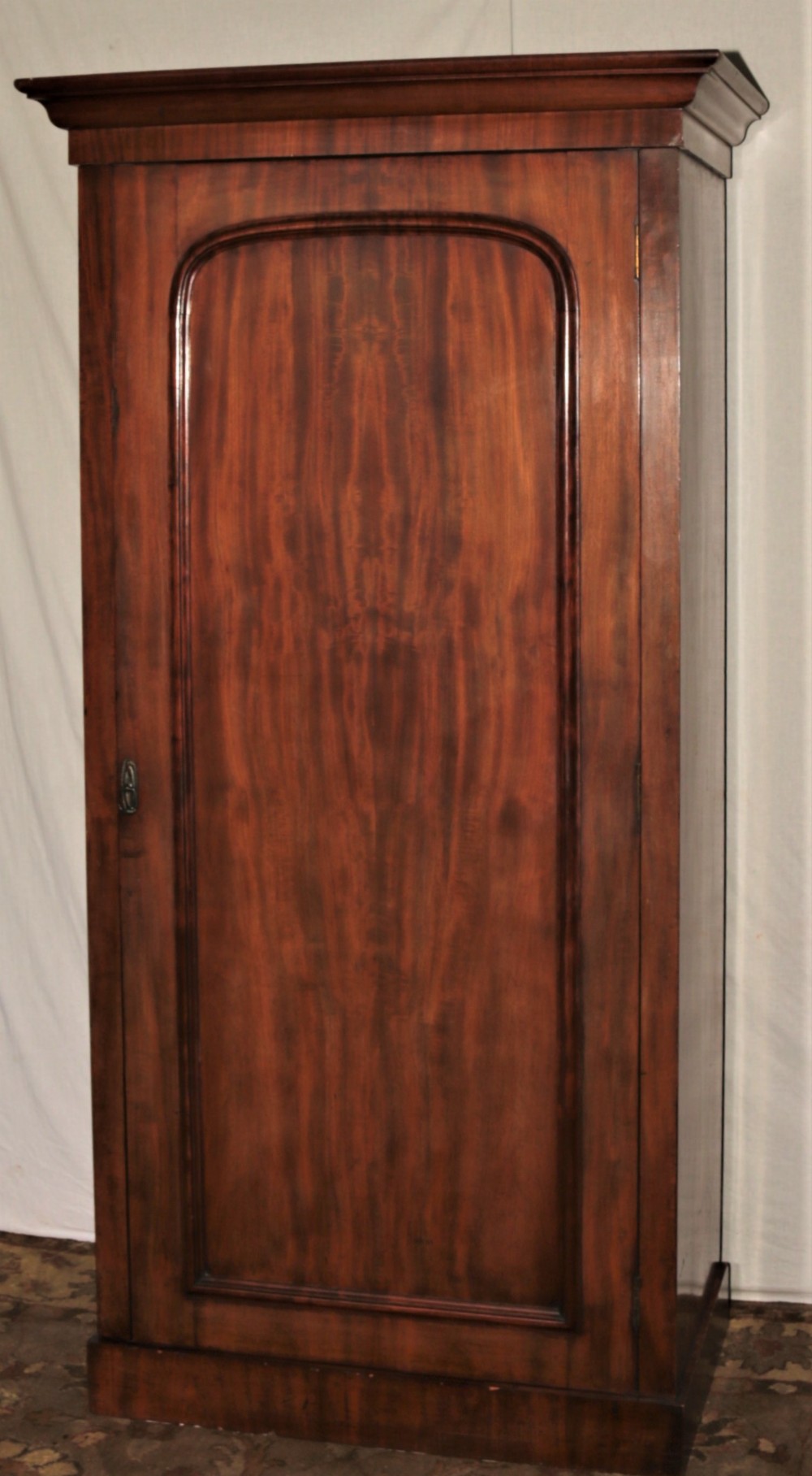 Victorian single-door narrow wardrobe.
