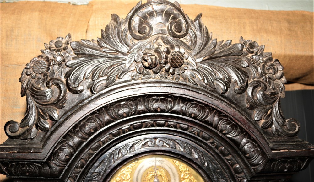Carved oak grandfather clock. View XIV