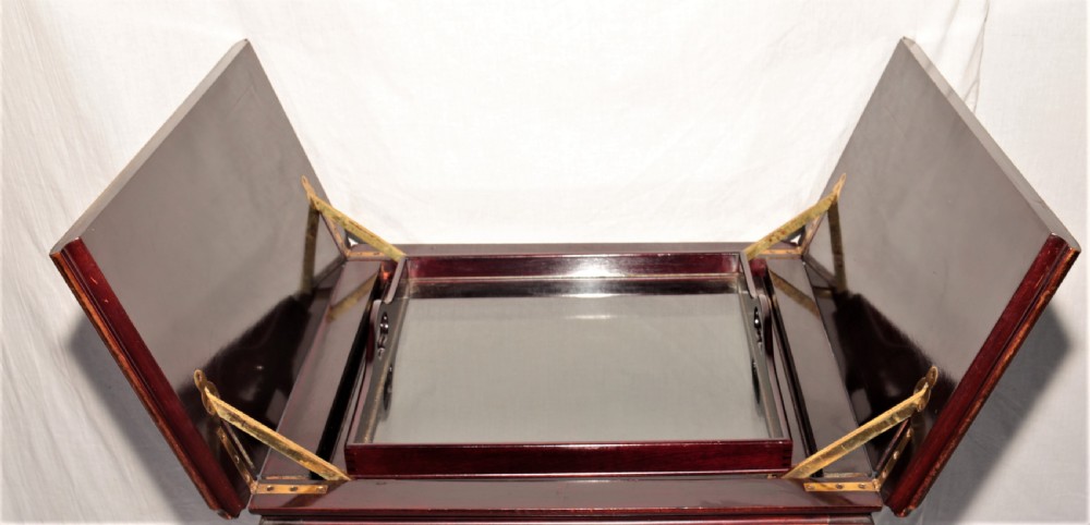 A dark mahogany metamorphic drinks table with cabriole legs, open side leaves, and an elevated glass tray displaying crystal glassware. View VIII