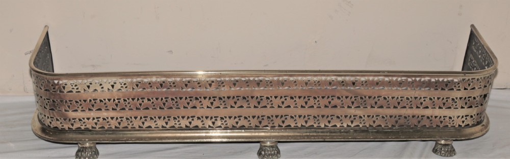 Victorian brass fire curb.