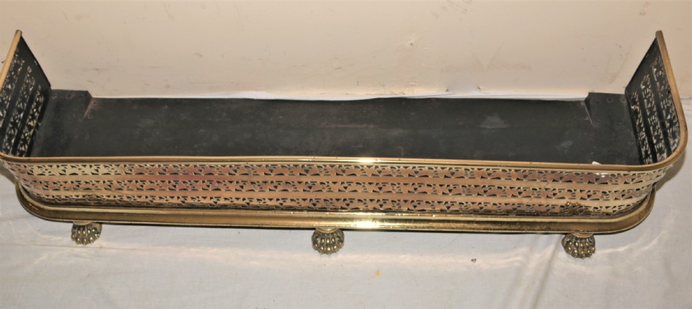 Victorian brass fire curb. View II