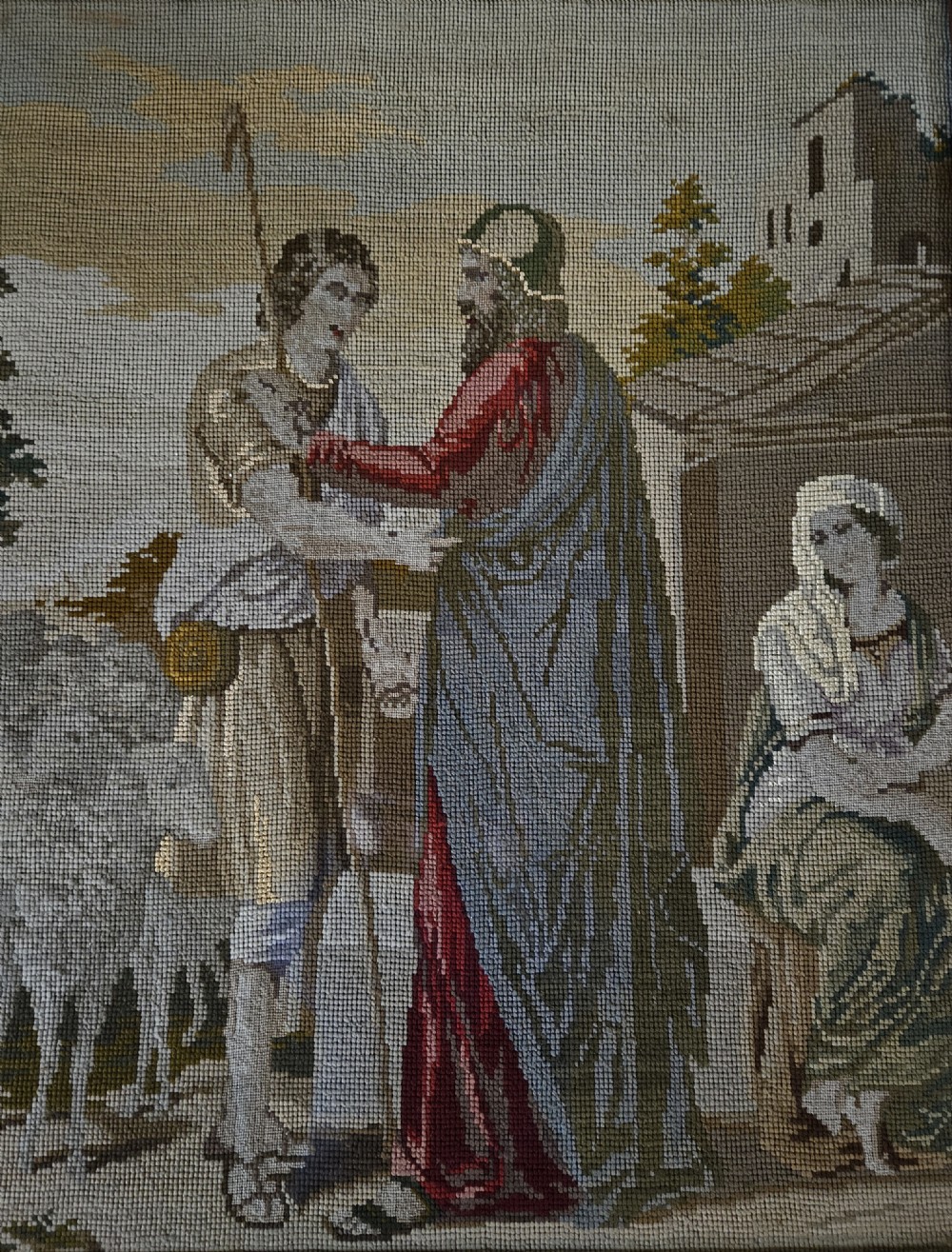 An antique Victorian needlepoint panel depicting a biblical scene enclosed in a carved mahogany frame with turned side spindles and finials. View III