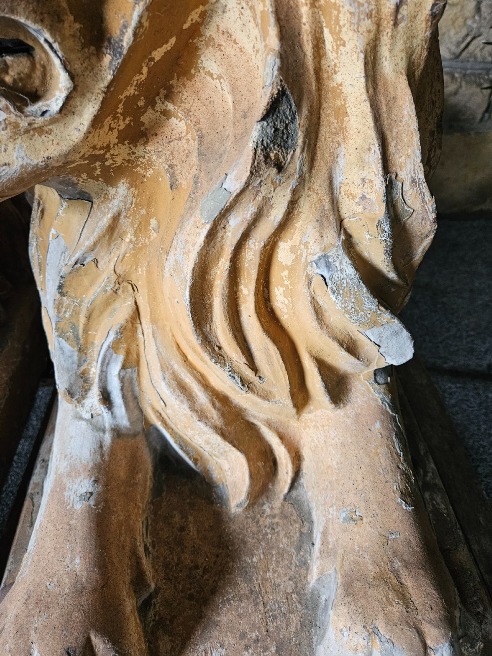 A pair of sculpted buff stone recumbent lion statues with detailed manes resting on integrated rectangular bases. View VII