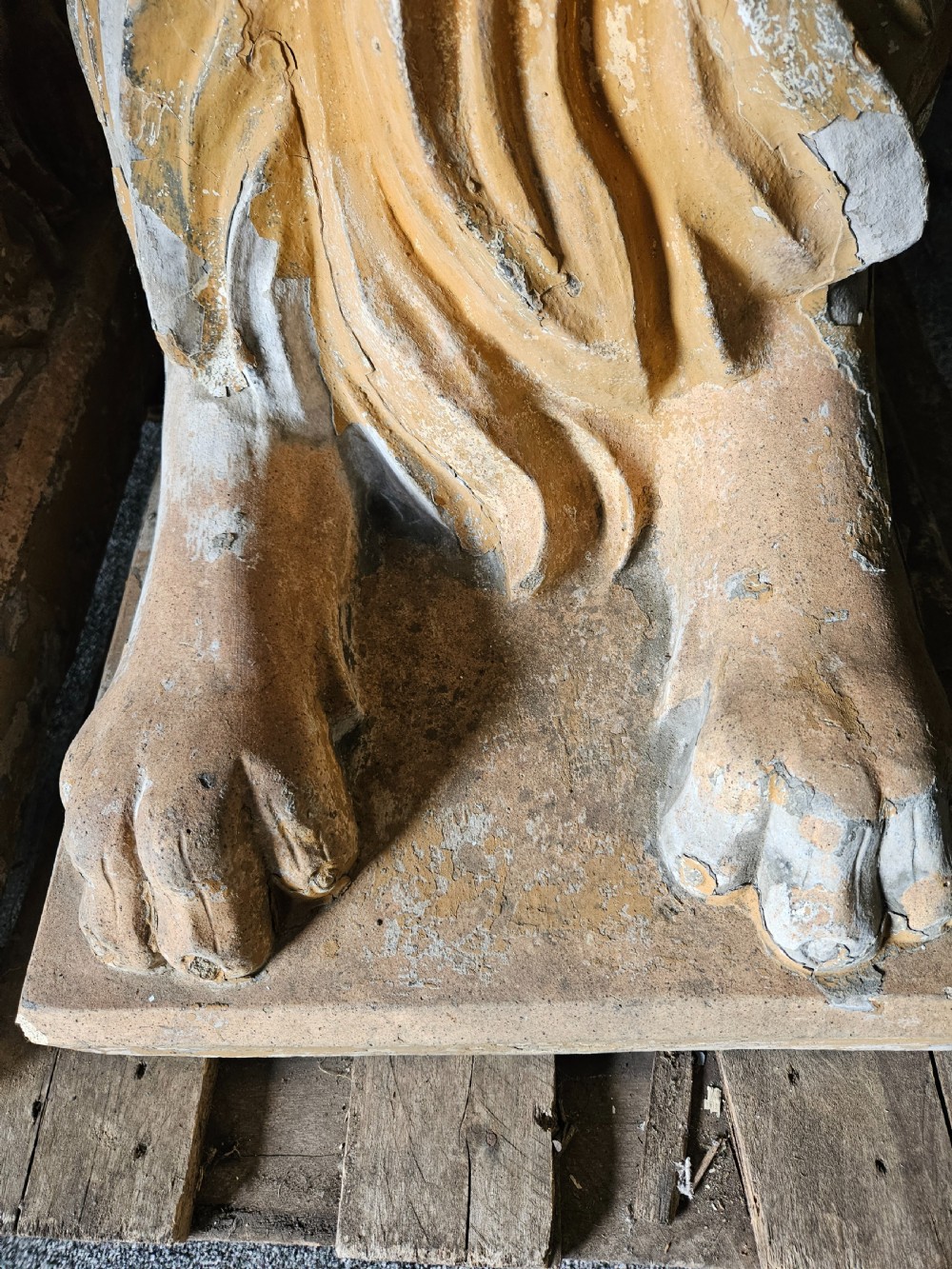 A pair of sculpted buff stone recumbent lion statues with detailed manes resting on integrated rectangular bases. View IX