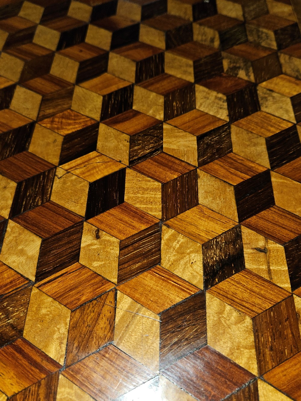 A rectangular wooden side table with a geometric tumbling block parquetry top and barley twist turned legs. View III