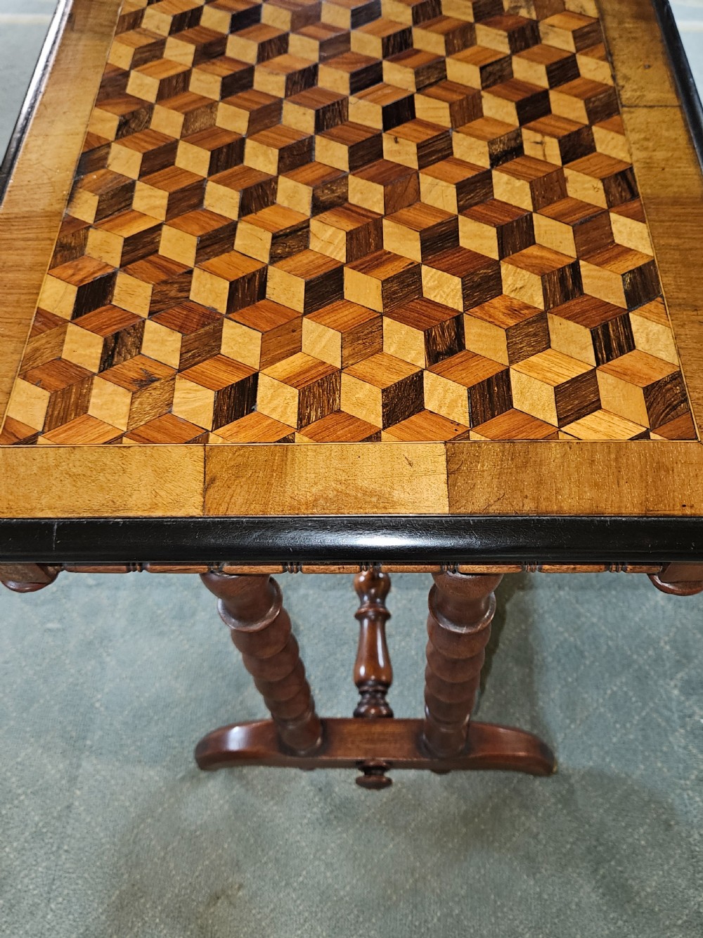 A rectangular wooden side table with a geometric tumbling block parquetry top and barley twist turned legs. View IV