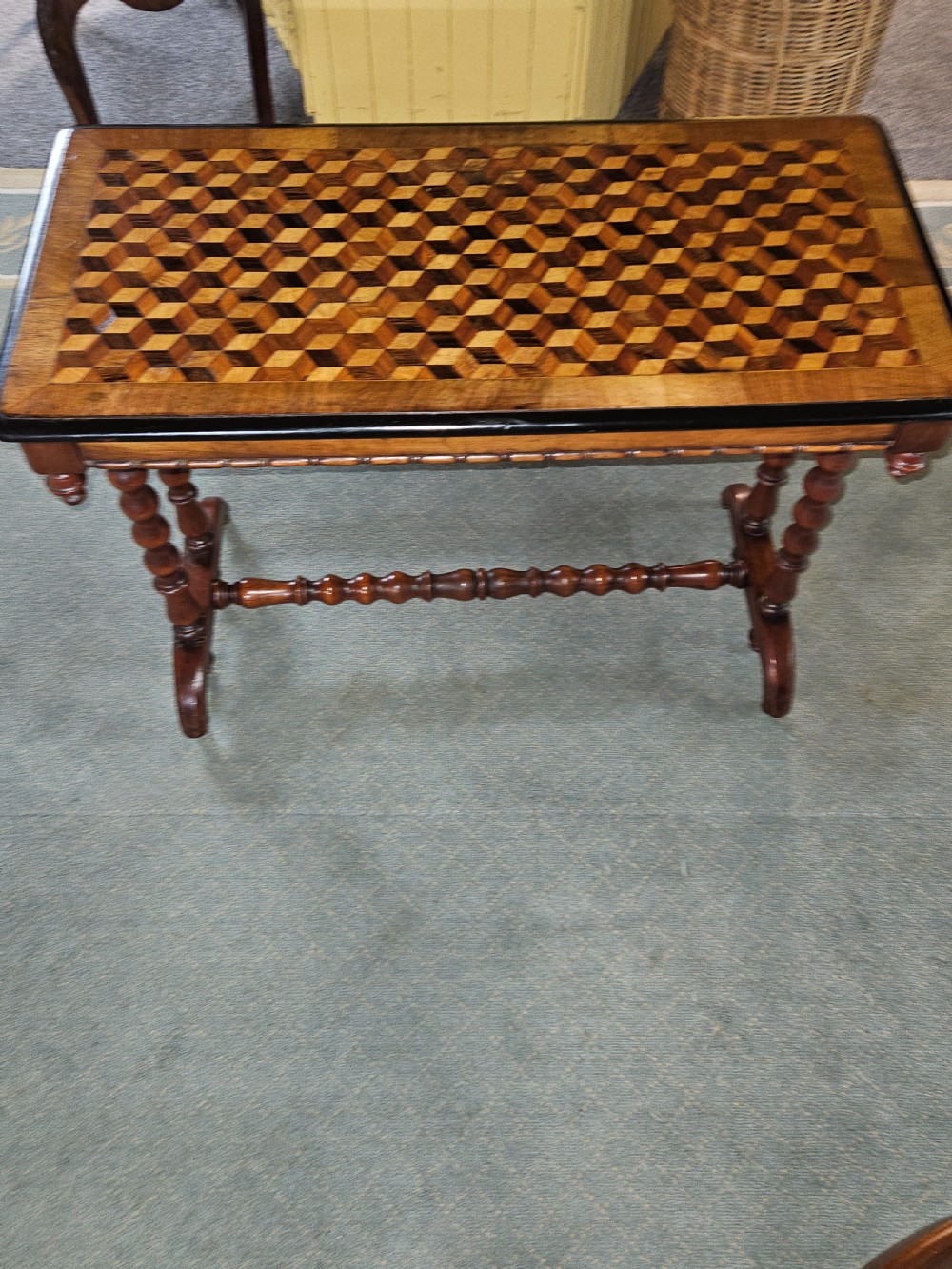 A rectangular wooden side table with a geometric tumbling block parquetry top and barley twist turned legs. View XII