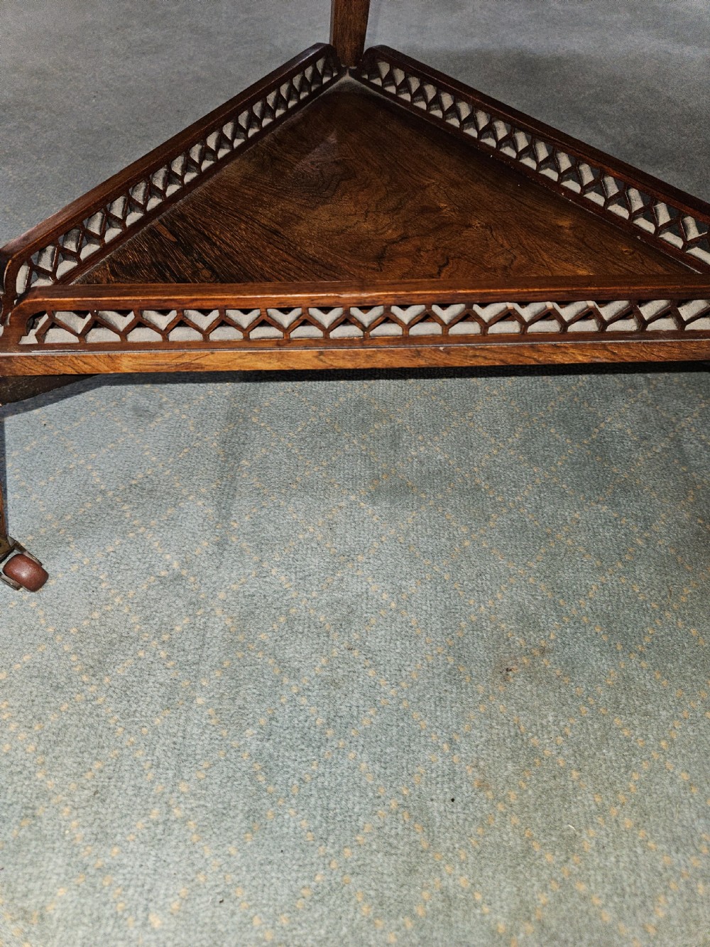 An inlaid rosewood drop-leaf table with extended circular scalloped leaves showing intricate floral marquetry and central geometric grain patterns. View VIII