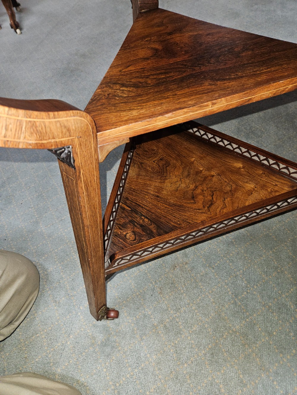 An inlaid rosewood drop-leaf table with extended circular scalloped leaves showing intricate floral marquetry and central geometric grain patterns. View IX