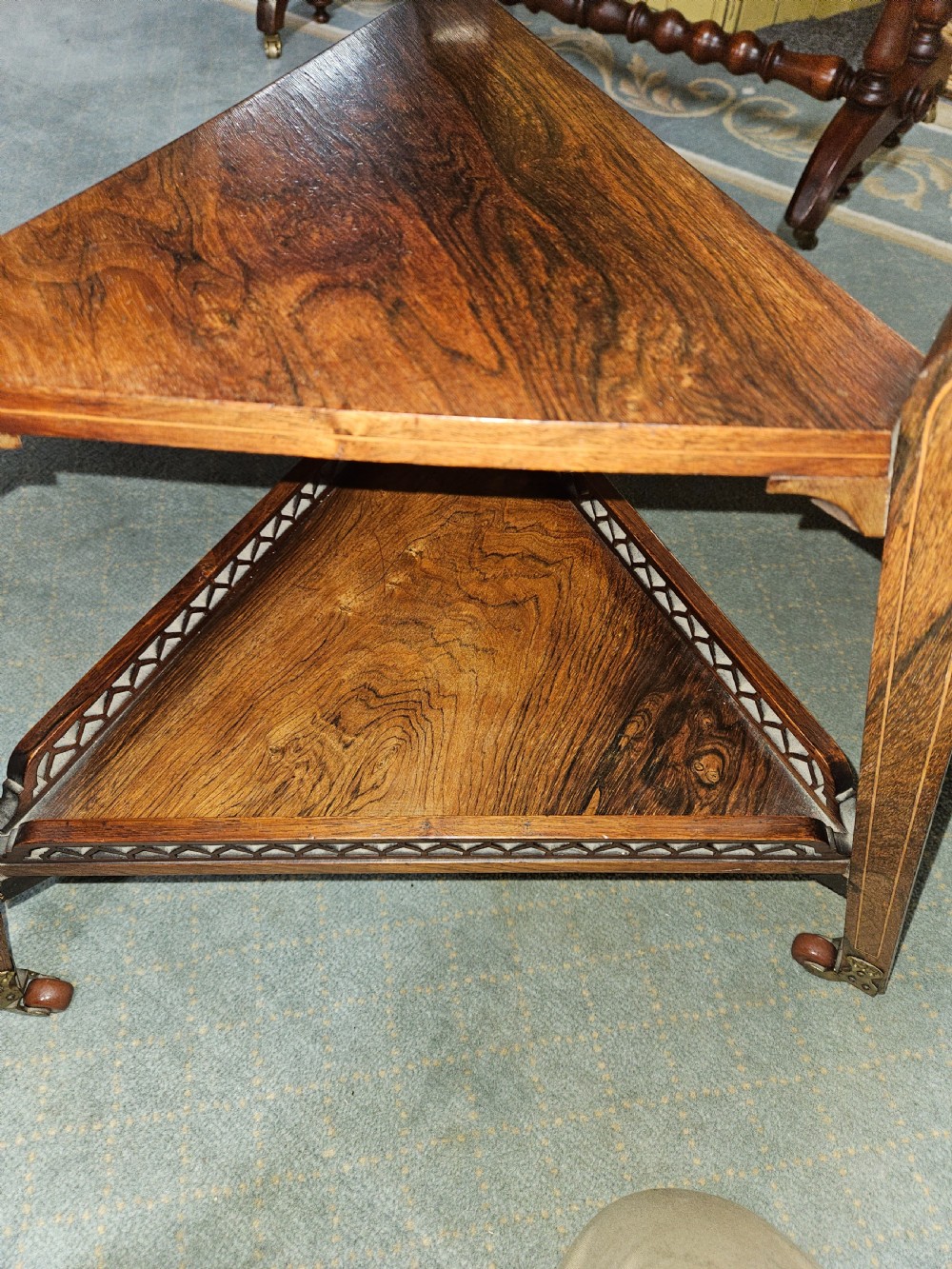 An inlaid rosewood drop-leaf table with extended circular scalloped leaves showing intricate floral marquetry and central geometric grain patterns. View X