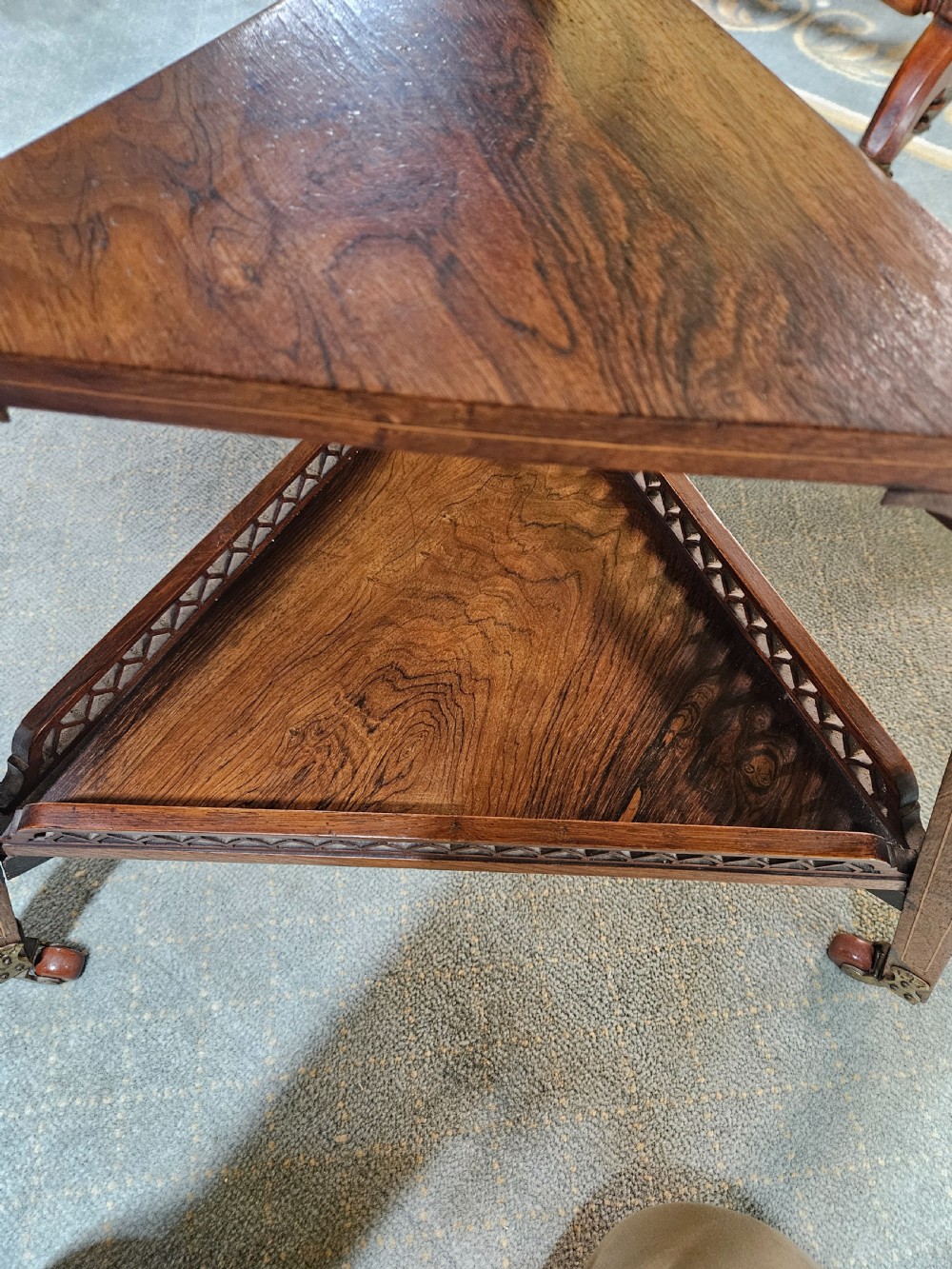 An inlaid rosewood drop-leaf table with extended circular scalloped leaves showing intricate floral marquetry and central geometric grain patterns. View XI