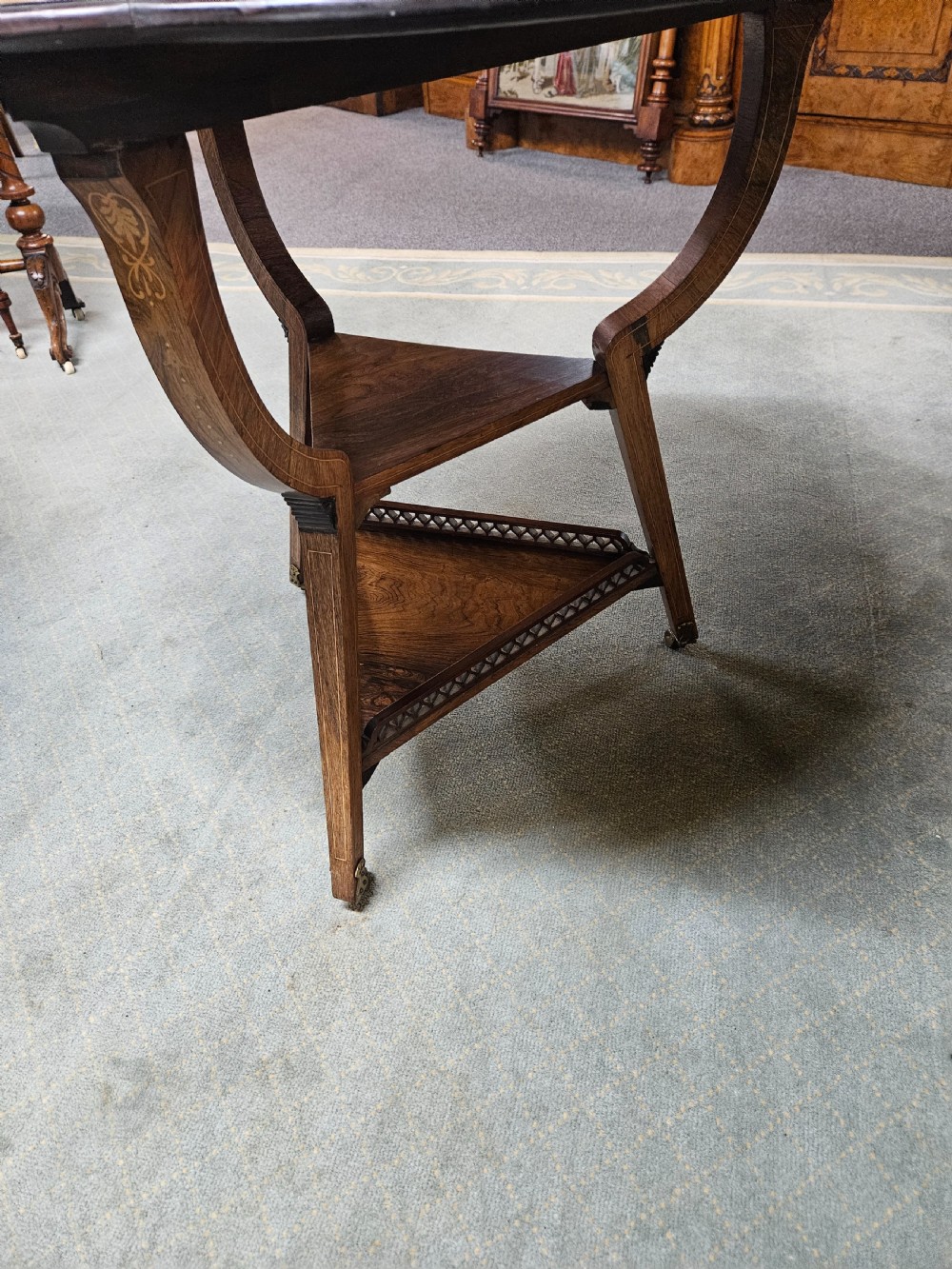 An inlaid rosewood drop-leaf table with extended circular scalloped leaves showing intricate floral marquetry and central geometric grain patterns. View XIV