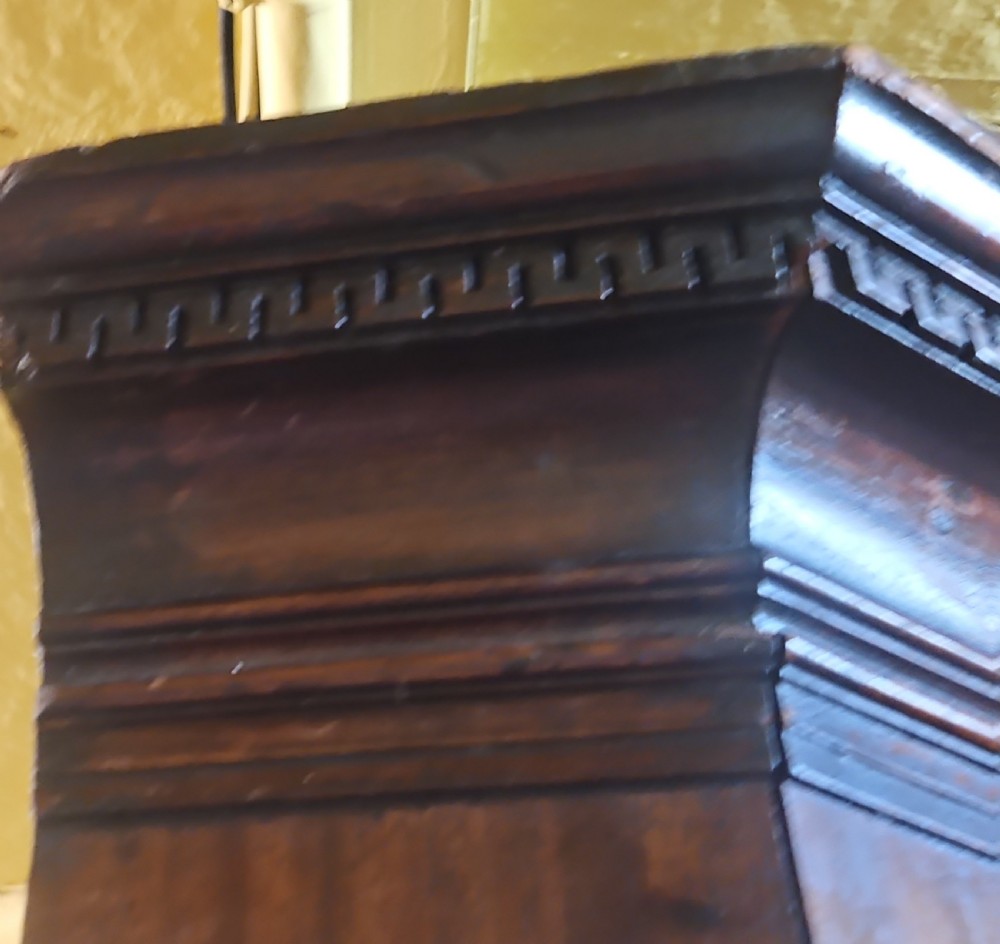 A tall two-tier Georgian mahogany corner cabinet with open upper panelled doors revealing arched interior shelving, set above a two-door base cabinet. View VIII