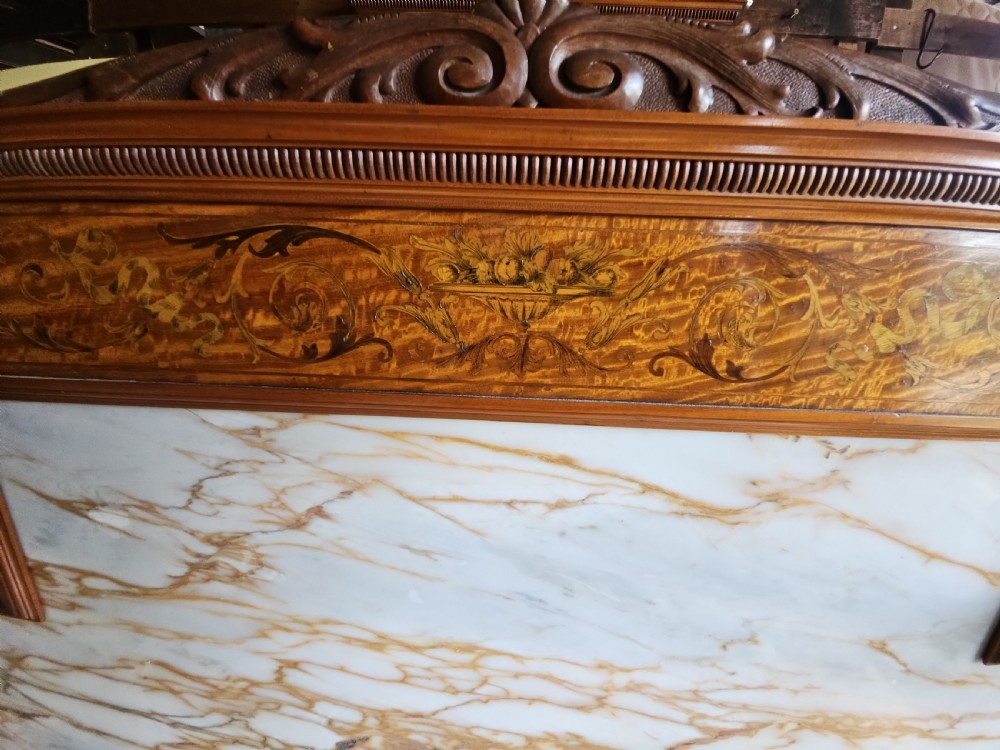 A satinwood inlaid washstand featuring a dark veined marble surface and splashback above three drawers and twin cupboard doors with inlaid urn motifs. View II