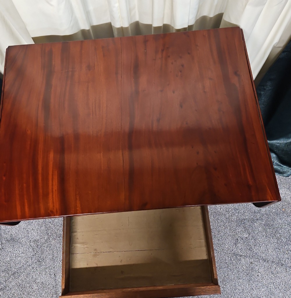 A Victorian mahogany drop-leaf sofa table with burr walnut veneered drawers, turned twin-column legs, and a shaped quadruped base on castors. View IV