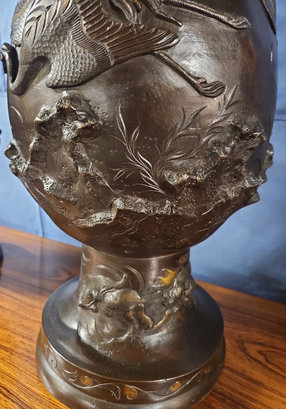 A pair of large Japanese bronze vases featuring high-relief sculpted dragons around the necks and crane motifs on bulbous bases with gilt detailing. View XII