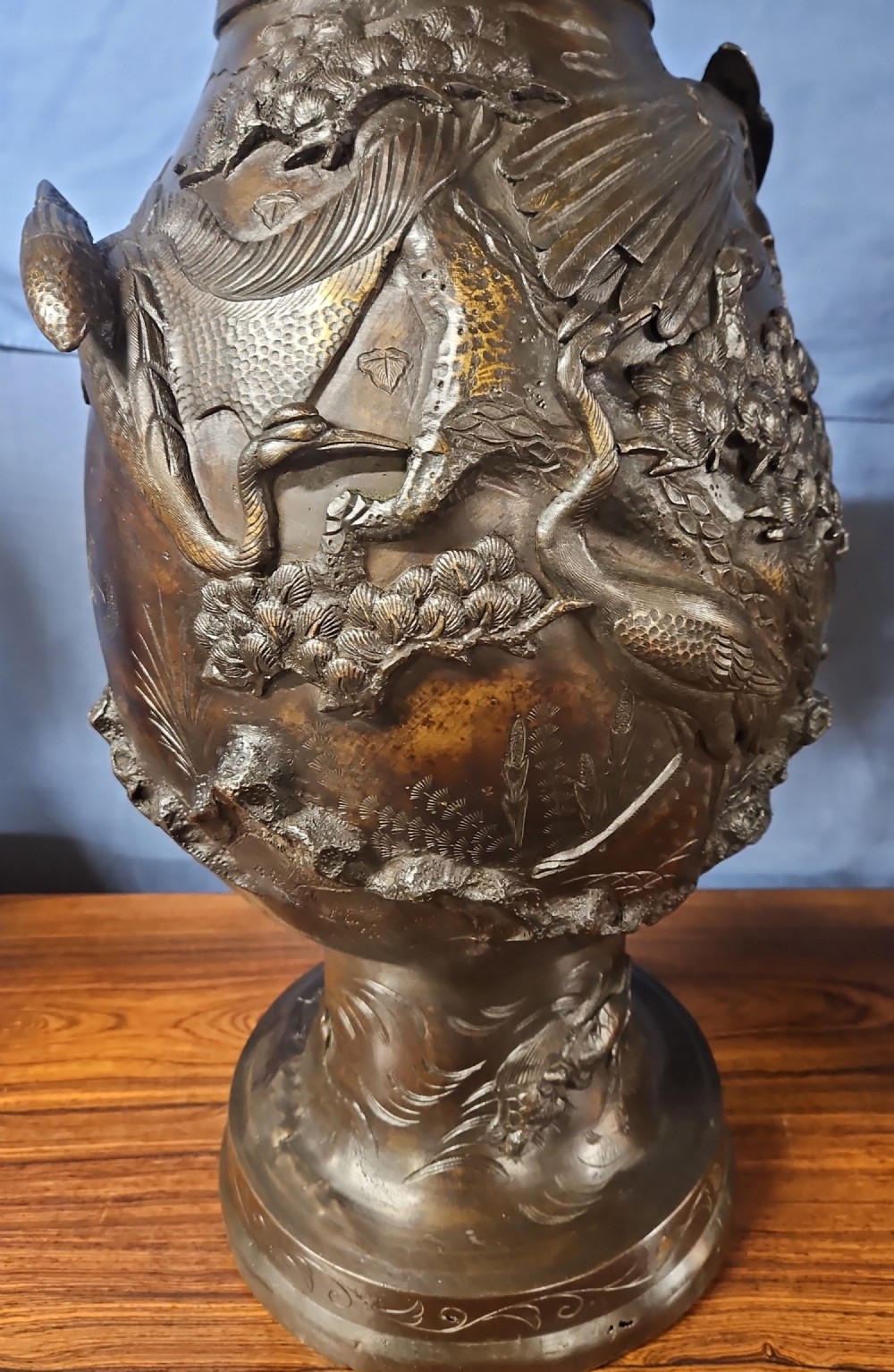 A pair of large Japanese bronze vases featuring high-relief sculpted dragons around the necks and crane motifs on bulbous bases with gilt detailing. View XIV