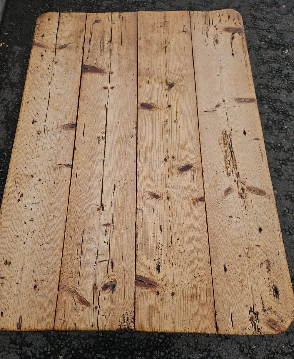 A rectangular Victorian pine table featuring a multi-plank top with visible grain patterns and four turned wooden legs. View II
