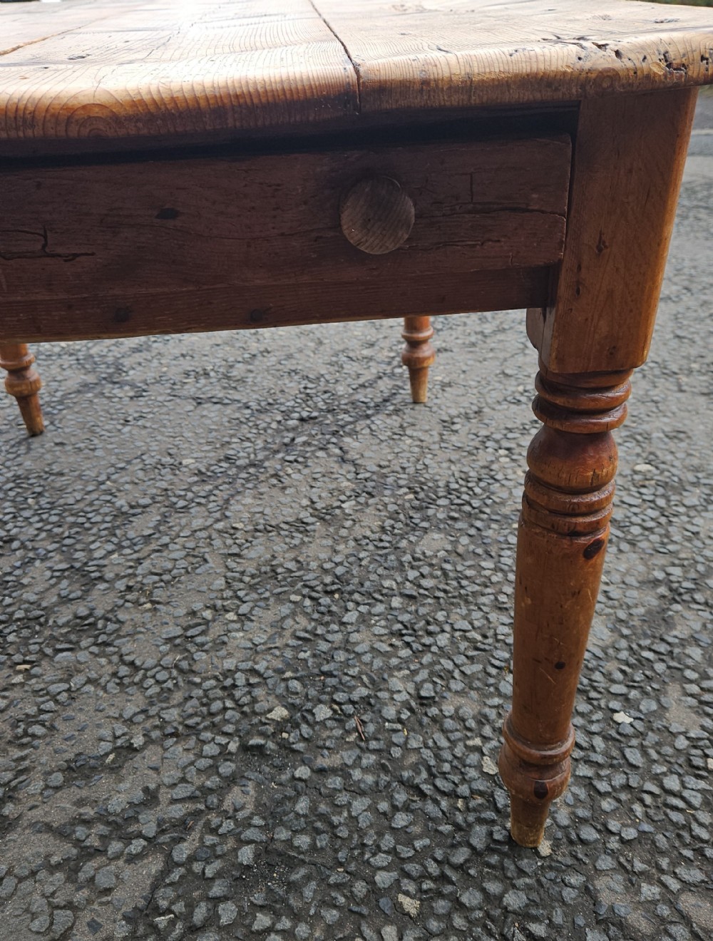 A rectangular Victorian pine table featuring a multi-plank top with visible grain patterns and four turned wooden legs. View IV