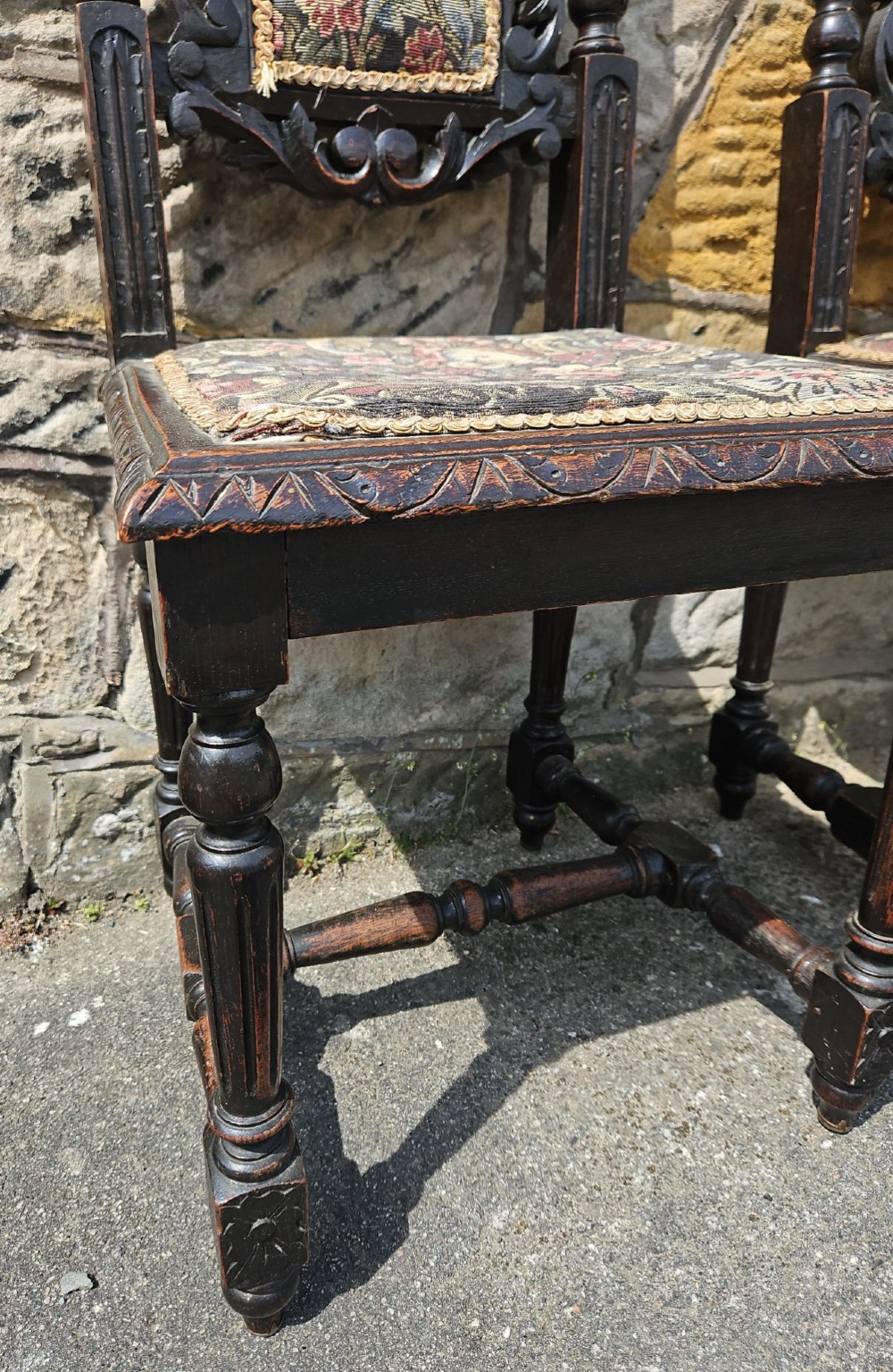 A pair of Victorian carved oak chairs View II