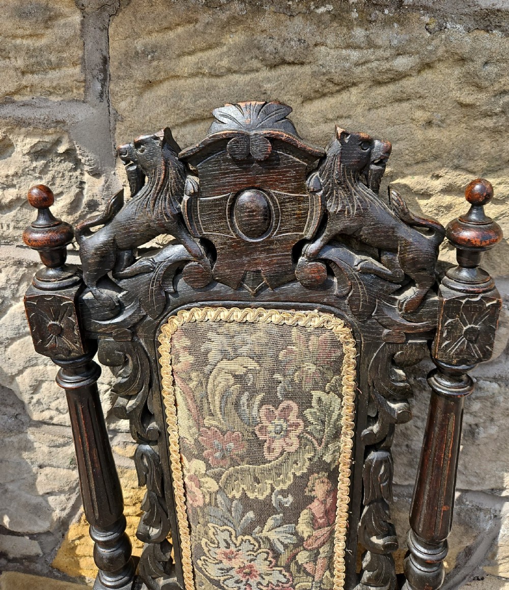 A pair of Victorian carved oak chairs View VI