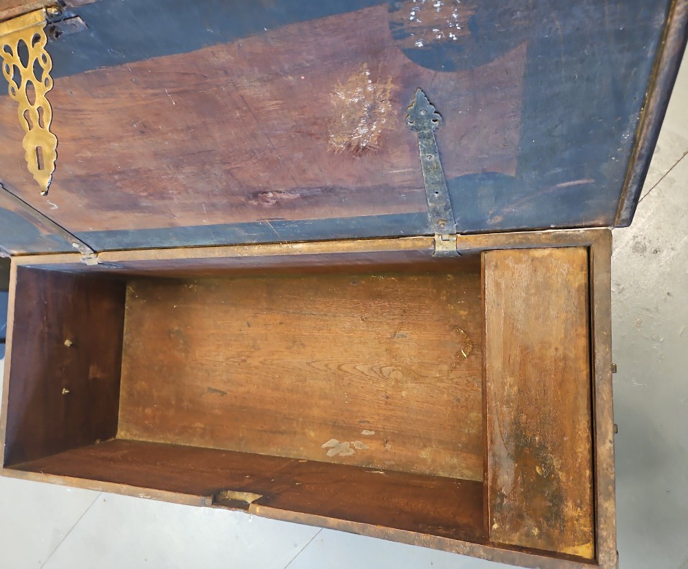 A mid-Victorian wooden Zanzibar chest decorated with intricate brass studs, geometric brass sheeting, and three base drawers. View IX