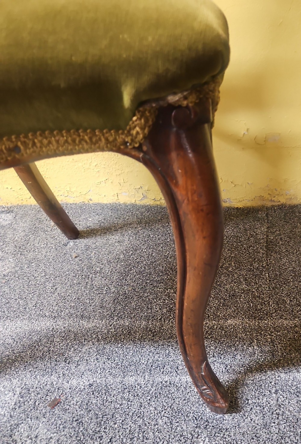 A pair of Victorian carved walnut balloon-back side chairs featuring olive green velvet upholstered seats and front cabriole legs. View IV