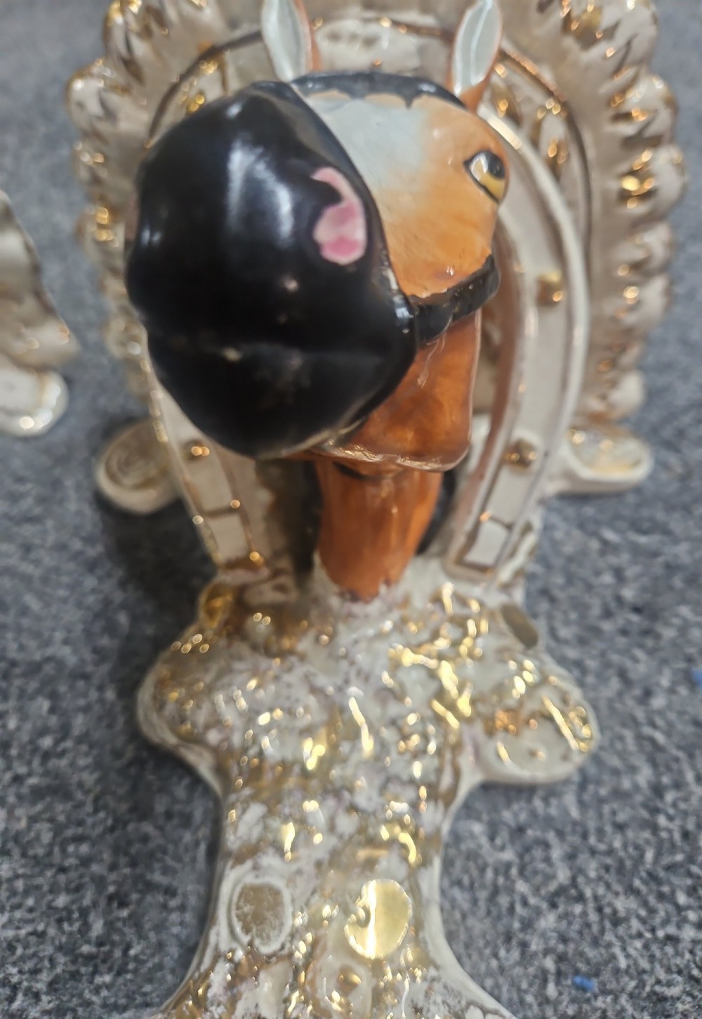 A pair of Victorian Staffordshire earthenware wall brackets featuring moulded horse heads framed by horseshoes with gilded decorative borders. View VIII