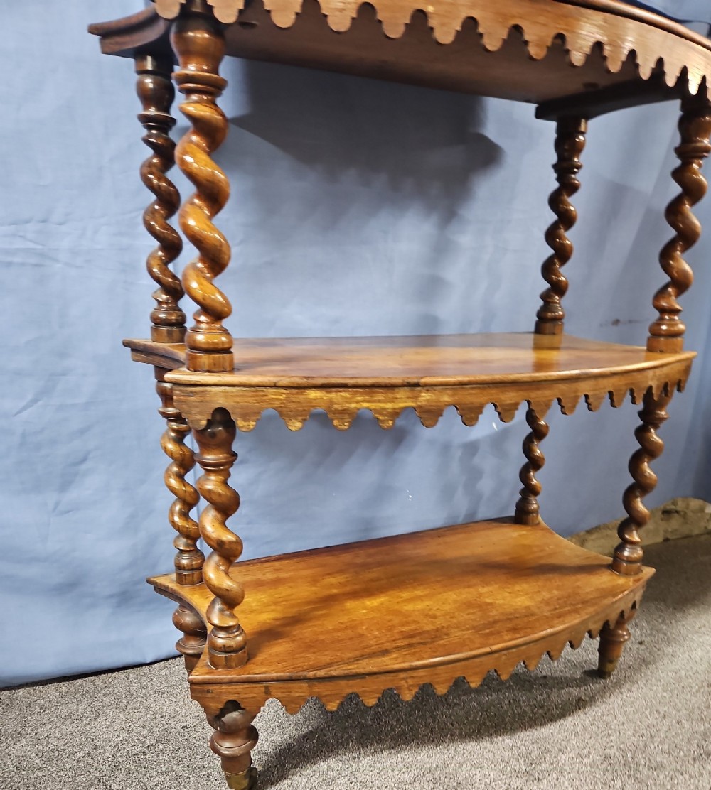 A multi-tiered Victorian rosewood etagere featuring barley twist supports, scalloped shelf aprons, and inset mirrored panels. View II