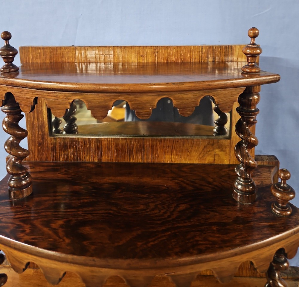 A multi-tiered Victorian rosewood etagere featuring barley twist supports, scalloped shelf aprons, and inset mirrored panels. View IV