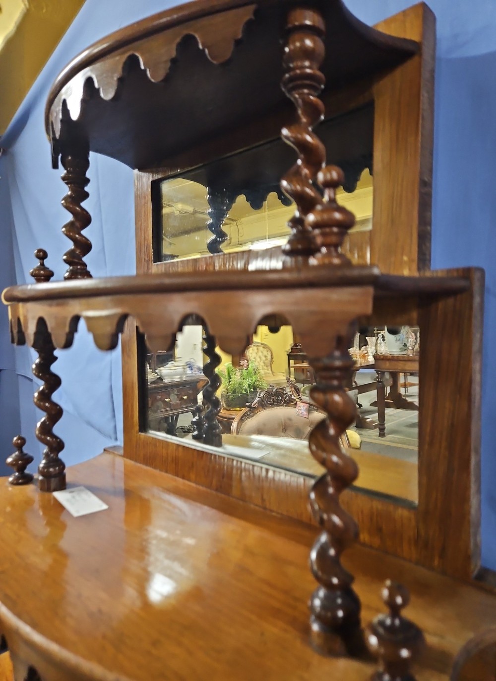 A multi-tiered Victorian rosewood etagere featuring barley twist supports, scalloped shelf aprons, and inset mirrored panels. View V