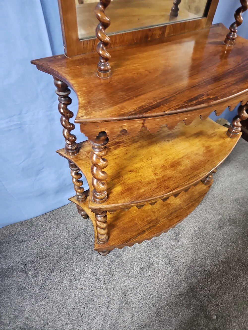 A multi-tiered Victorian rosewood etagere featuring barley twist supports, scalloped shelf aprons, and inset mirrored panels. View VII