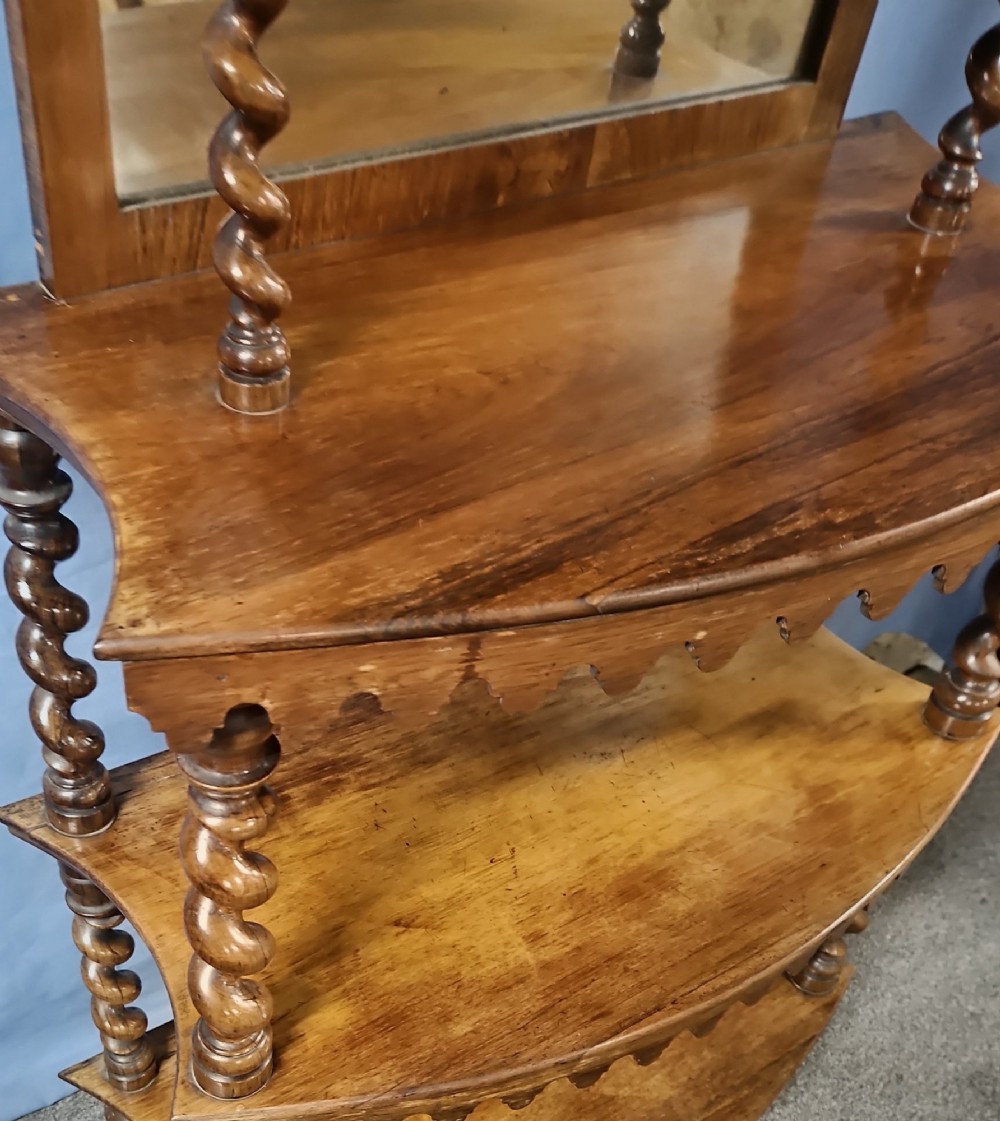A multi-tiered Victorian rosewood etagere featuring barley twist supports, scalloped shelf aprons, and inset mirrored panels. View VIII