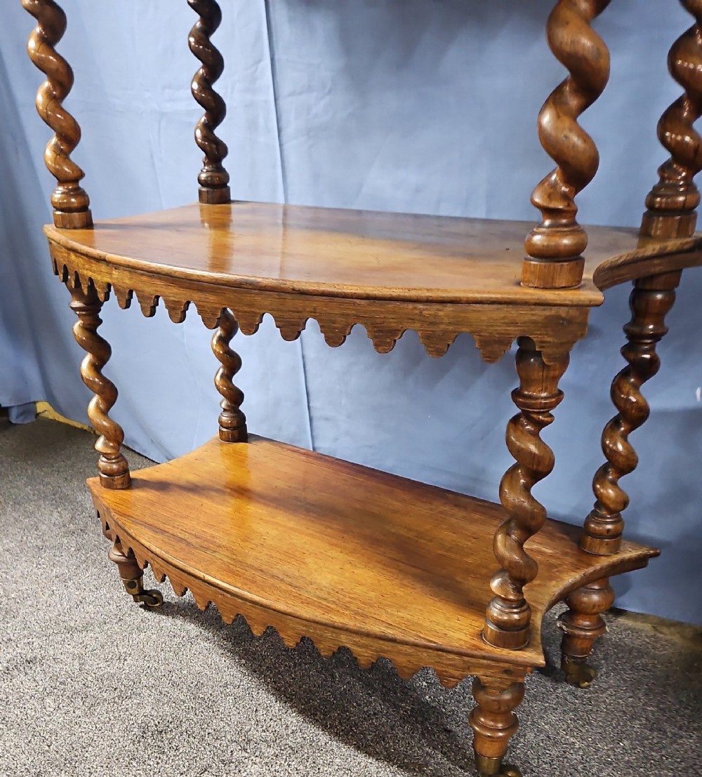 A multi-tiered Victorian rosewood etagere featuring barley twist supports, scalloped shelf aprons, and inset mirrored panels. View IX