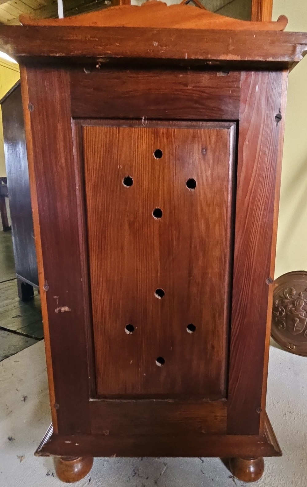 A single door satinwood bedside cabinet featuring detailed floral marquetry inlay on the panel, carved upper corbels, and a brass drop handle. View VI