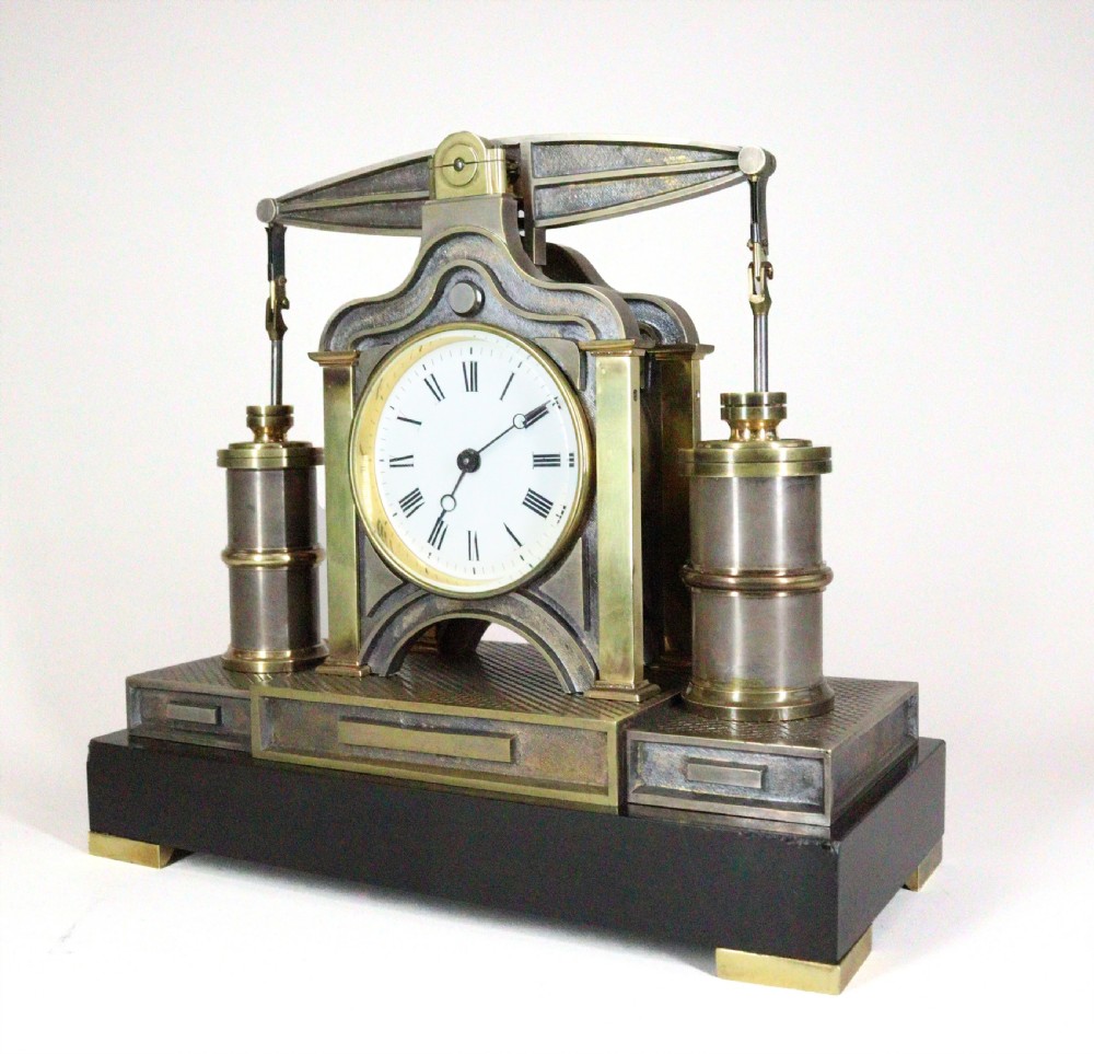 An industrial French automaton clock designed in the shape of a steam beam engine with brass and dark bronze components set on a black slate plinth. View II