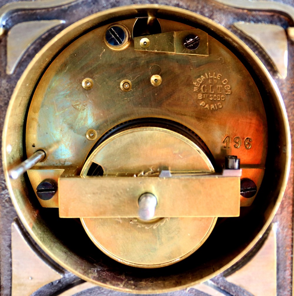 An industrial French automaton clock designed in the shape of a steam beam engine with brass and dark bronze components set on a black slate plinth. View VII
