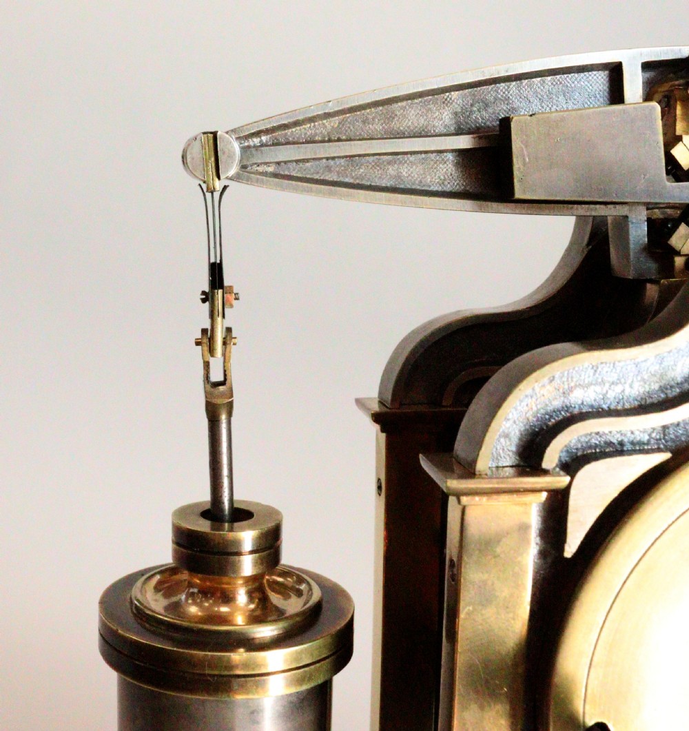 An industrial French automaton clock designed in the shape of a steam beam engine with brass and dark bronze components set on a black slate plinth. View X
