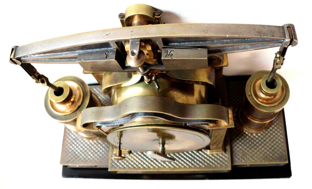 An industrial French automaton clock designed in the shape of a steam beam engine with brass and dark bronze components set on a black slate plinth. View XIII