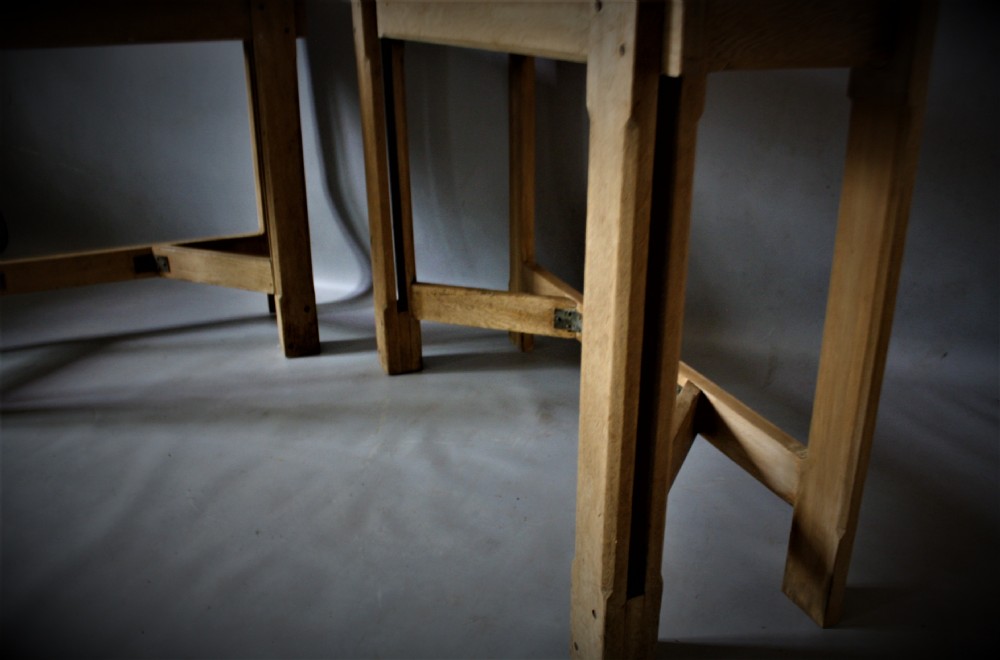A pair of matching natural oak console tables in the Arts and Crafts style featuring straight rectangular tops, square legs, and Y-shaped lower stretchers. View IV