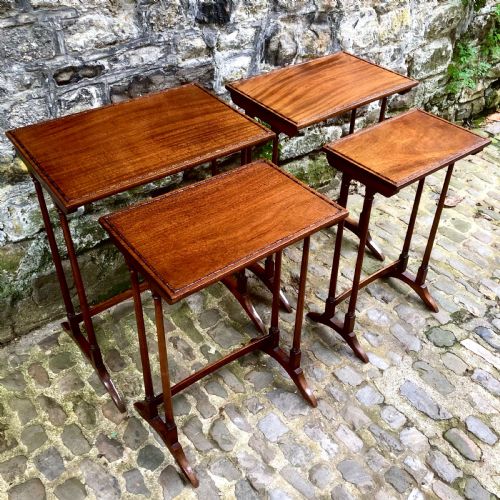 AN EDWARDIAN MAHOGANY NEST OF FOUR TABLES - ADDITIONAL PHOTO 4