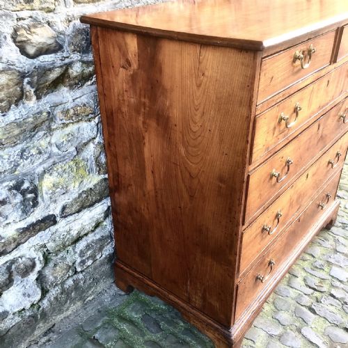 A GEORGE III CHERRY WOOD CHEST OF DRAWERS - ADDITIONAL PHOTO 3