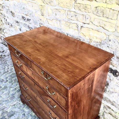 A GEORGE III CHERRY WOOD CHEST OF DRAWERS - ADDITIONAL PHOTO 8