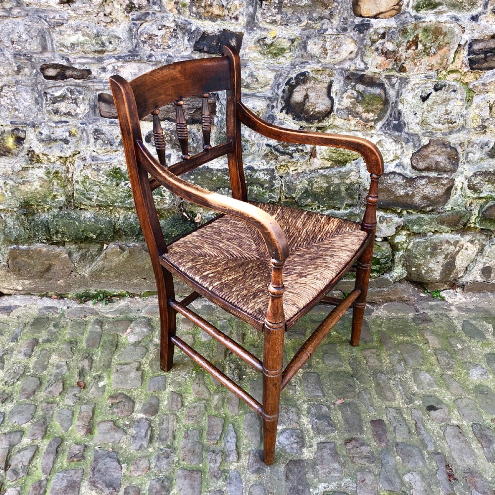 An early 19th century country elbow chair  View II