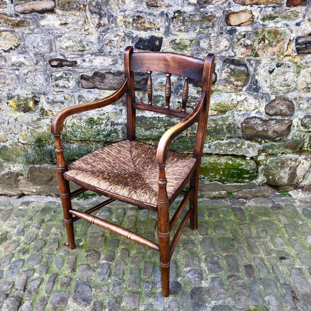 An early 19th century country elbow chair  View III
