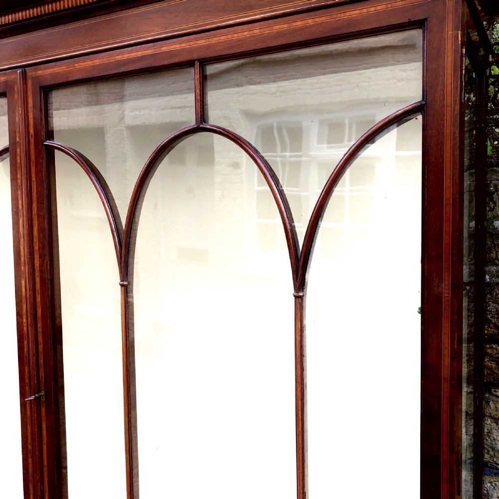An Edwardian mahogany display cabinet on stand by Maples.  View VI