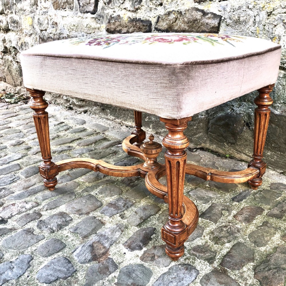A Louis XVI style walnut dressing table stool.  View II