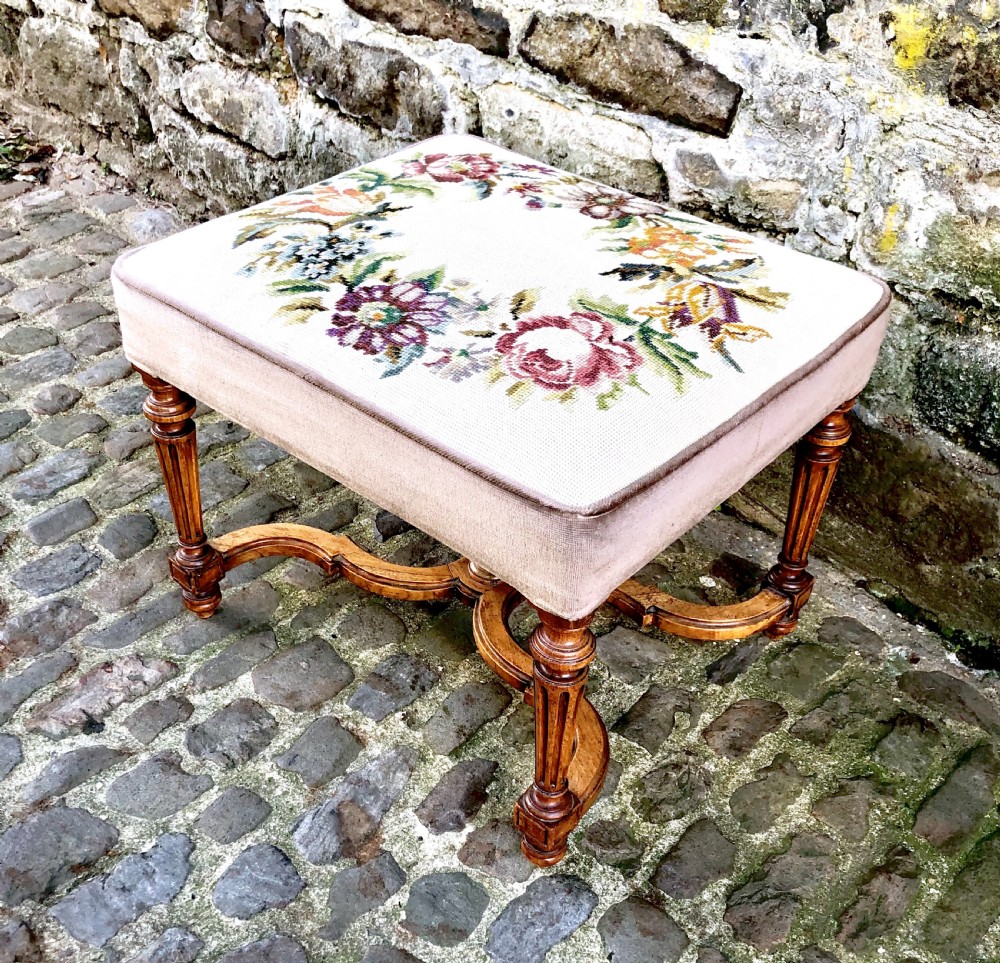 A Louis XVI style walnut dressing table stool.  View IV